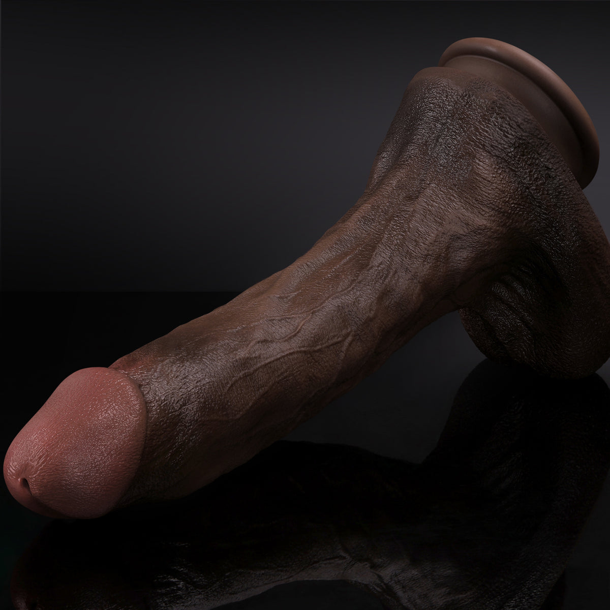 Close-up of realistic brown Dongkinger replica dildo with suction cup base on reflective surface.