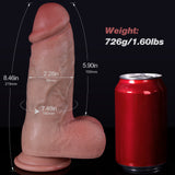 A large dildo is next to a red soda can with dimensions.
