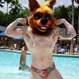 Muscular hyena fursuit man flexing by pool, showcasing HIMBOHYENA replica dildo replica.
