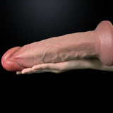 A hand holds a realistic dildo against a black background.