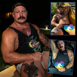 Tattooed muscular man in tank top poses with Big Dick Buddy replica dildo.
