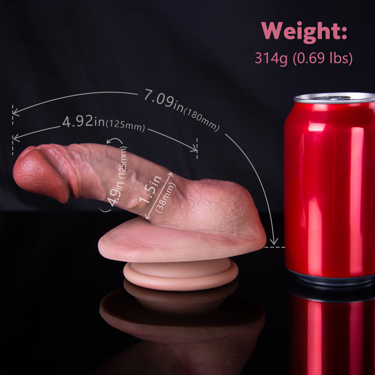 A hand holding a sex toy next to a red soda can.
