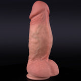 A flesh-colored dildo stands upright against a dark background.