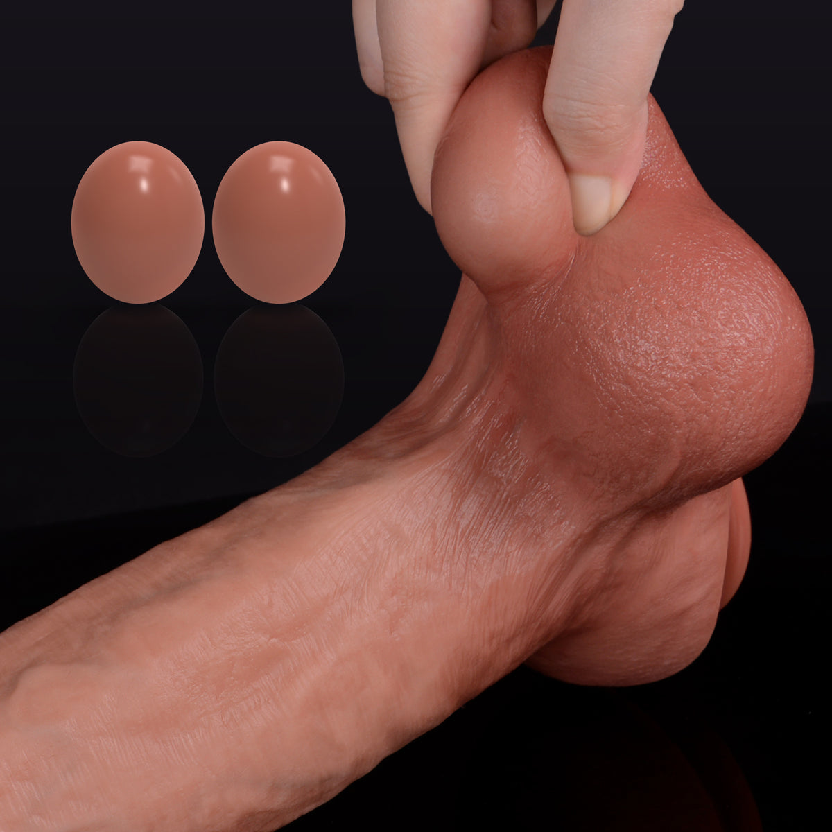 Realistic dildo with moving balls, textured skin, and prominent glans.