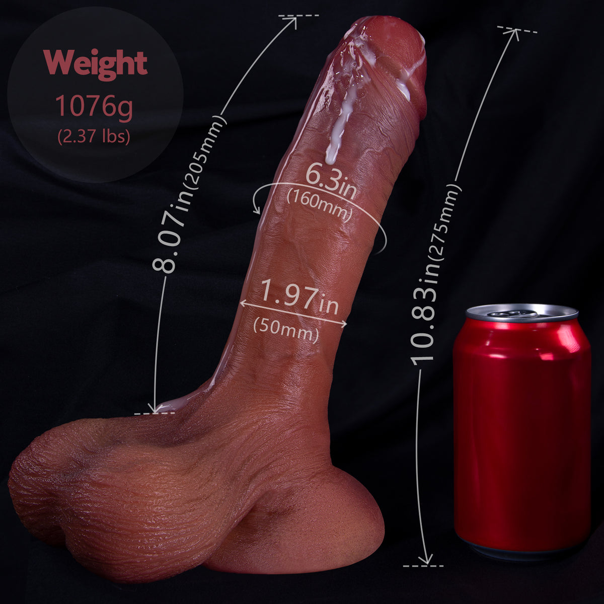 A dildo is shown next to a red soda can with measurements.