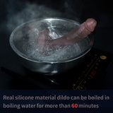 A dildo is boiling in a pot on an induction cooker.