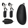 A black device with two clamps and a remote control.
